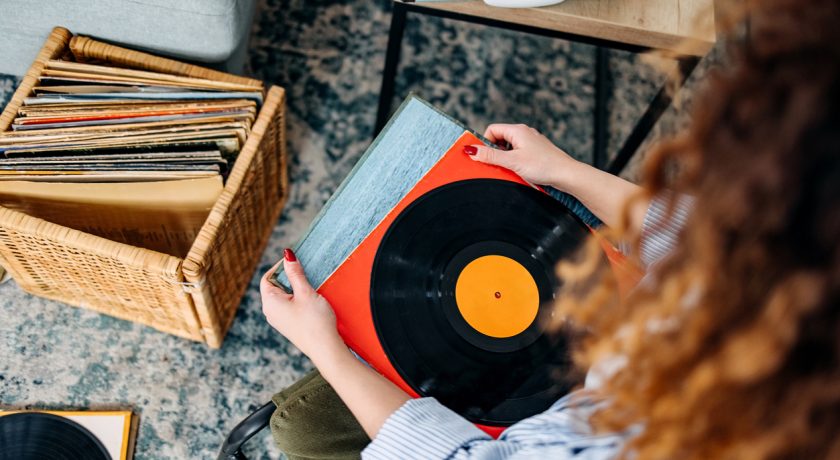 Woman holding vinyl records.